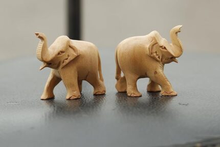 Decorative wooden elephant statues on display