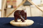 Down trunk red sandalwood elephant figurine handcrafted on wooden base