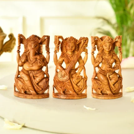 Handmade sandalwood lakshmi, ganesh, and saraswati statues spiritual idol set